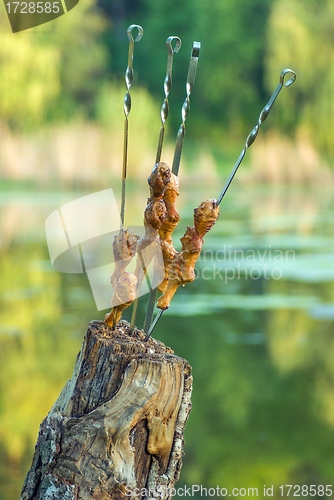 Image of Grilled  chicken legs on skewers