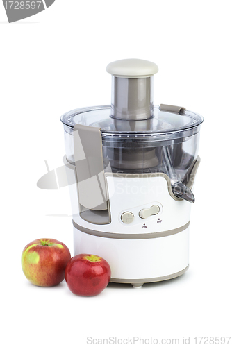 Image of Electrical juicing machine and two apples