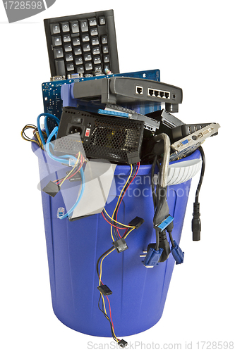 Image of electronic scrap in blue trash can