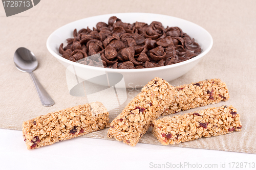 Image of Chocolate cereals and bars with fruits.