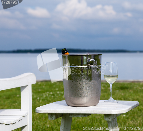 Image of Garden chair and champagne by Chesapeake bay