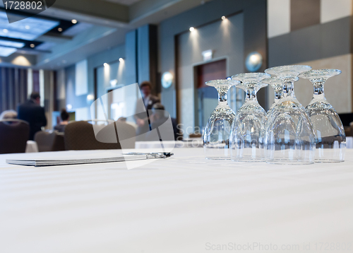 Image of Conference room with tables with people