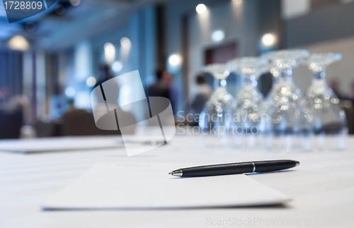 Image of Conference room with tables with people