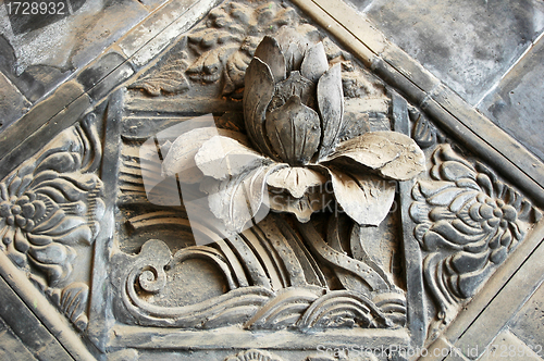 Image of Ancient brick carving art of lotus