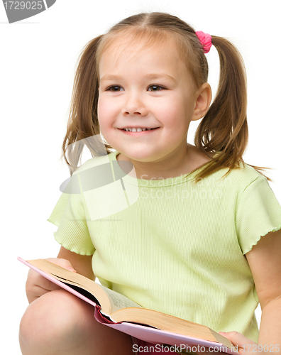 Image of Cute little girl with book