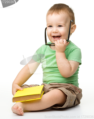 Image of Cute little boy with book