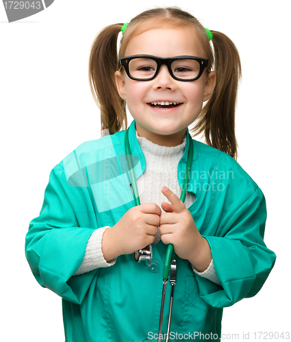 Image of Cute little girl is playing doctor