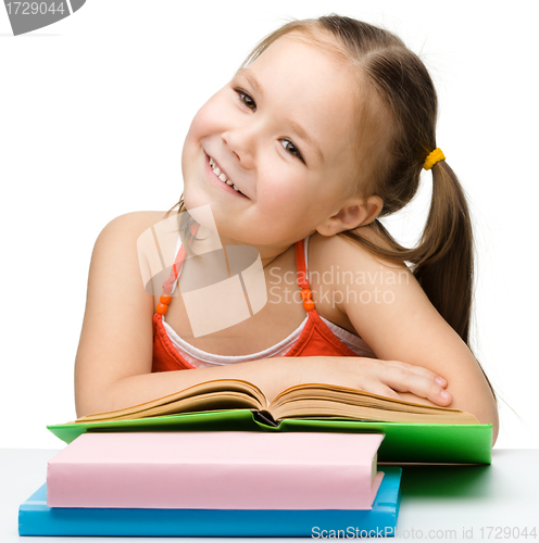 Image of Cute little girl with books