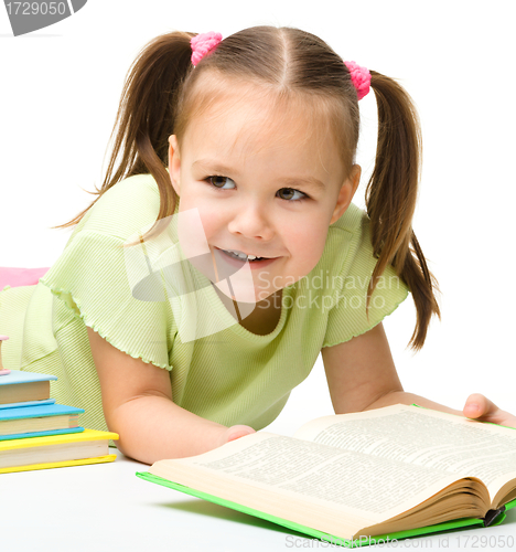 Image of Cute little girl with books