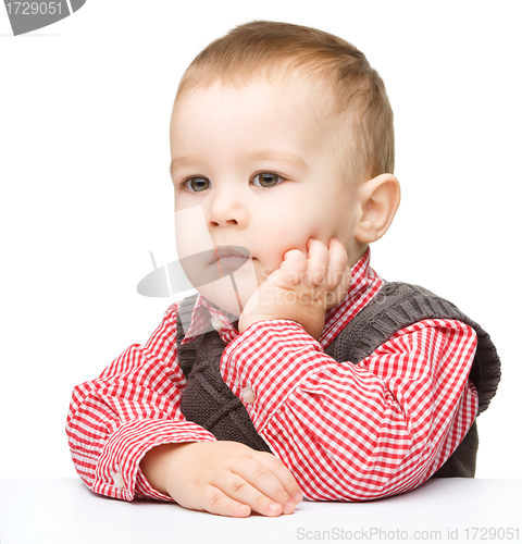 Image of Portrait of a cute and pensive little boy