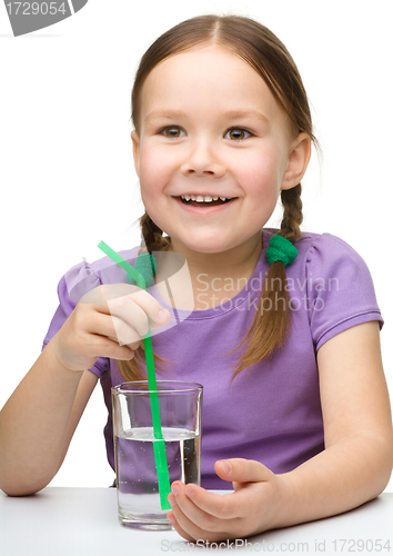 Image of Cute little girl with a glass of water