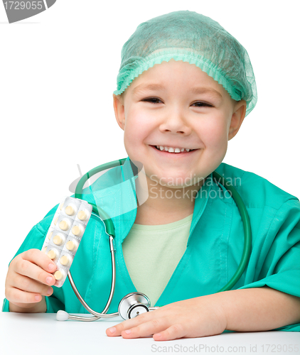 Image of Cute little girl is playing doctor