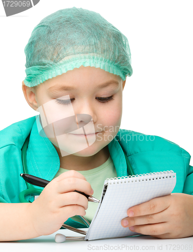 Image of Cute little girl is playing doctor