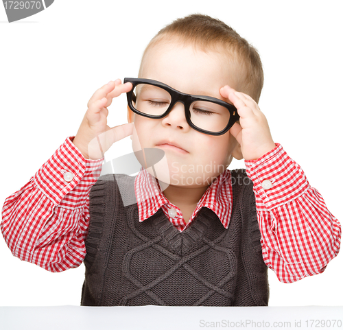 Image of Portrait of a cute little boy wearing glasses