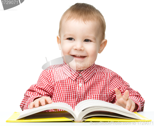 Image of Little child play with book
