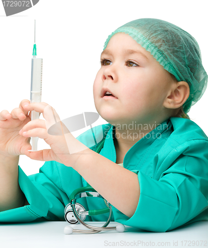 Image of Cute little girl is playing doctor with syringe