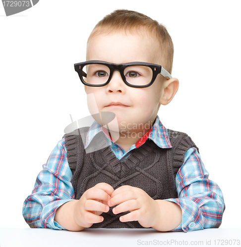 Image of Portrait of a cute little boy wearing glasses