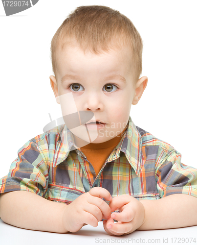 Image of Portrait of a cute and pensive little boy