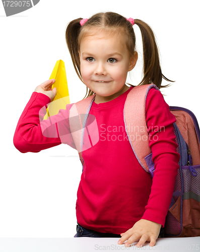 Image of Portrait of a cute schoolgirl with backpack