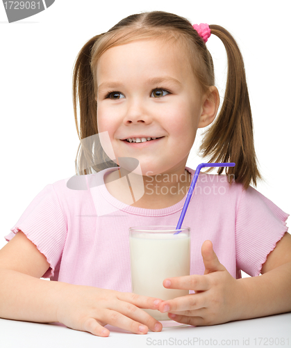 Image of Cute little girl with a glass of milk