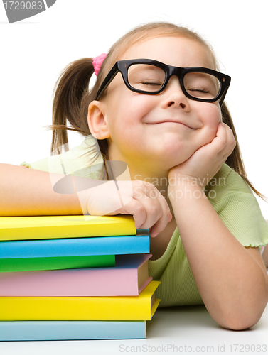 Image of Cute little girl with books