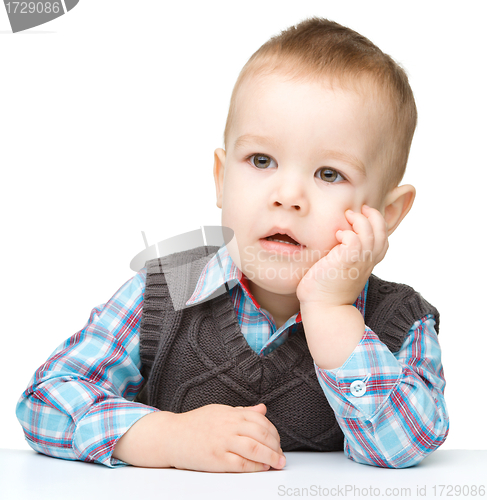 Image of Portrait of a cute and pensive little boy