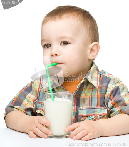 Image of Cute little boy with a glass of milk