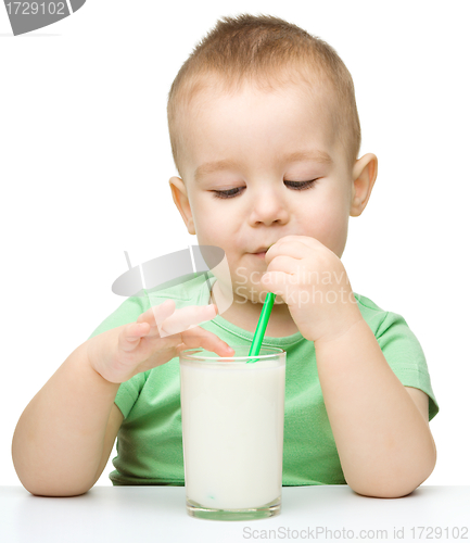 Image of Cute little boy with a glass of milk