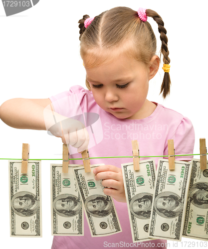 Image of Cute little girl with paper money - dollars