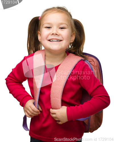 Image of Portrait of a cute schoolgirl with backpack
