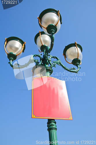 Image of Green lamp under blue sky