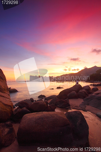 Image of Sunset with sea stones under long exposure