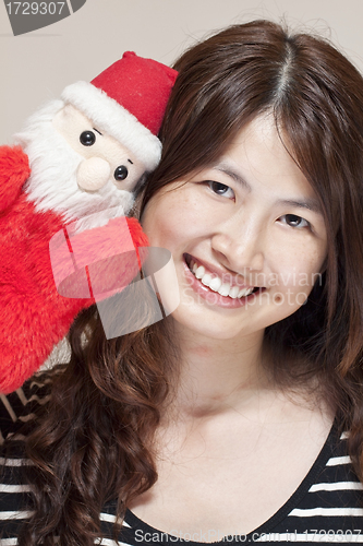 Image of Christmas celebration by asian woman