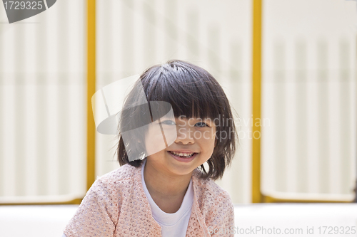 Image of A young asian girl smiling