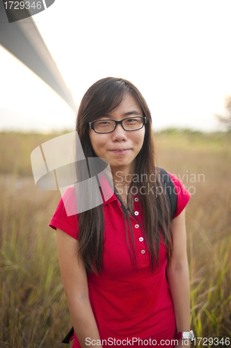 Image of Asian girl smiling outdoor