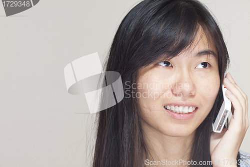 Image of Asian woman talking on phone