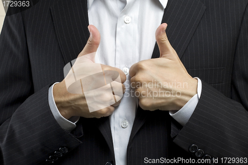 Image of Business man with thumbs up, means successful deal.