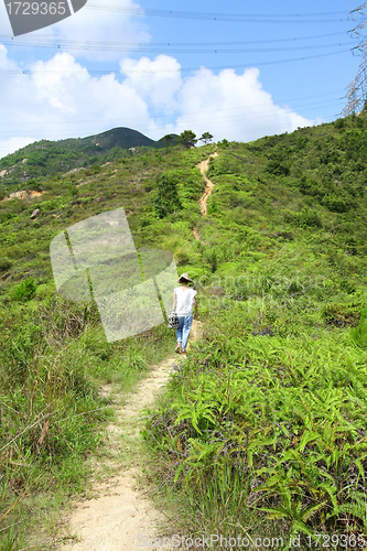 Image of Woman hiking in mountains