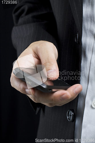 Image of Business man using smart cell phone