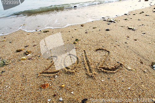 Image of 2012 year written on the beach sand