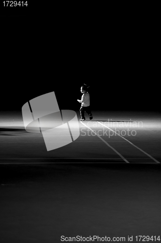 Image of Asian boy on the playground with black and white toned
