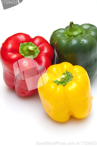 Image of Bell peppers (green, yellow and red) isolated on white backgroun