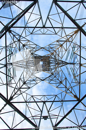 Image of Electrical tower over a blue sky background