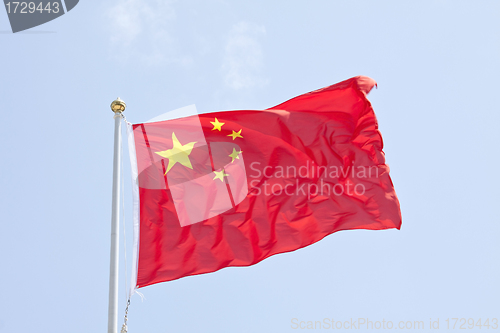 Image of China flag in blue sky