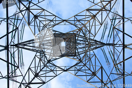 Image of Electrical tower over a blue sky background