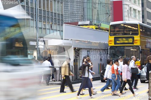 Image of Busy pedestrian in business district, blurred motion. 