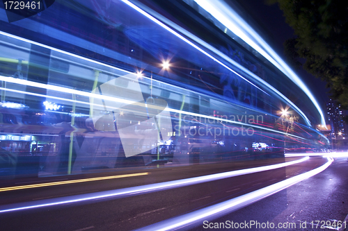 Image of Light trails at night with busy traffic