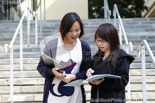 Image of Asian students on campus in a university