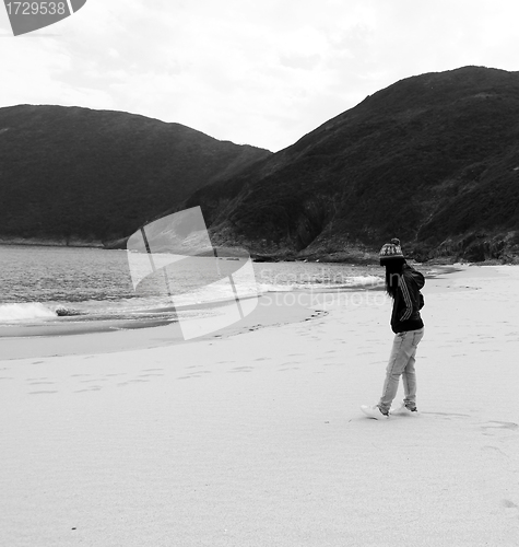 Image of Asian sad girl on beach 