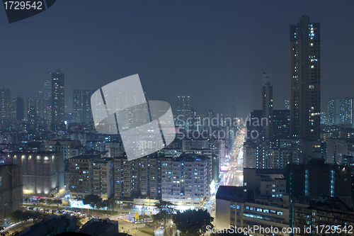 Image of Hong Kong downtown at night with highrise buildings